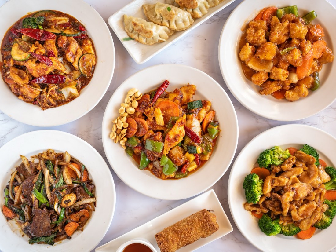 A family-style spread of Autumn Court catering trays for a Phoenix group